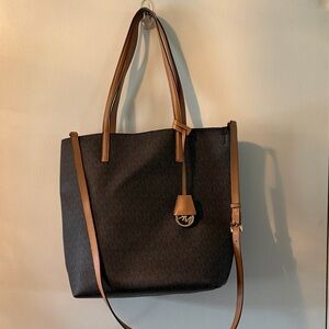 Michael Kors Black Tote with Tan Trim and MK Charm Included pouch.